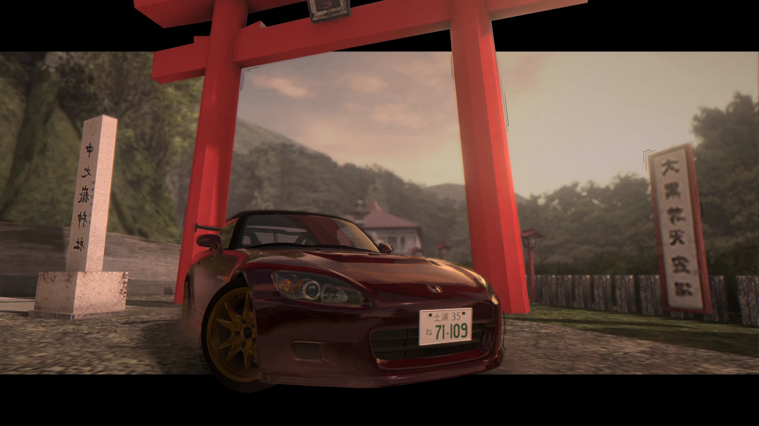 A red S2000 AP1 under a shrine gate on a mountain road